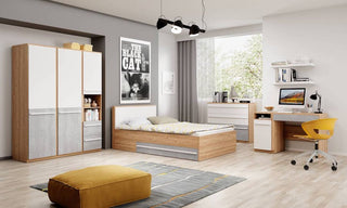 A modern bedroom with a CHOICEWARDROBE Peoria Sonoma Oak & White Small Double Bed with Storage Drawers (EU Size 120cm), a wardrobe, desk, computer, shelves, yellow chair, gray-and-yellow decor, large window, and a poster on the wall.