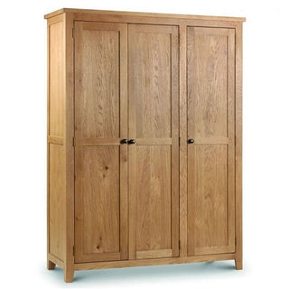 The CHOICEWARDROBE Porsha 142cm 3 Door Waxed Oak Wardrobe features a solid wooden frame, classic Shaker design, hanging rail, and shelves—perfect for stylish storage.