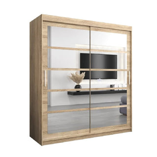 The CHOICEWARDROBE Reston 2 Door Sliding Mirrored Wardrobe (180cm, Sonoma Oak finish) with modern horizontal panels, drawers, and shelving reflects a stylish living room with a wall-mounted TV, floating shelf, and dried flower vase.