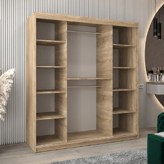 The CHOICEWARDROBE Reston 2 Door Sliding Mirrored Wardrobe in 180cm Sonoma Oak features a modern horizontal panel design, built-in drawers and shelves, fitting perfectly in a stylish room with neutral décor and vertical wall accents.