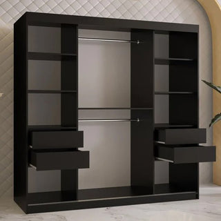 The CHOICEWARDROBE Rieti 2 Door Mirrored Sliding Wardrobe (180cm, Matt Black) features a modern panelled design with gold handles, a full-length mirror, and offers ample storage against a white quilted wall and marble floor.