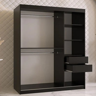 The CHOICEWARDROBE Rieti 2 Door Sliding Wardrobe in 150cm matt black features a modern panelled design, gold handles, and internal shelves—an ideal piece of bedroom furniture against a quilted white wall and marble floor.