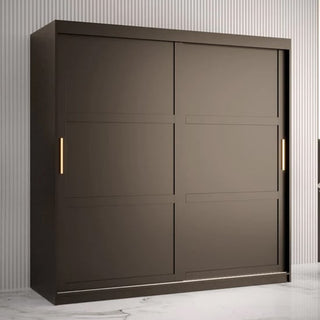 The CHOICEWARDROBE Rieti 2 Door Sliding Wardrobe in mocha brown, featuring gold handles, shelving, and drawer storage, stands against a light-colored vertically-striped wall on a white marble floor.