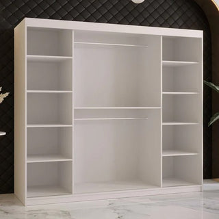 The CHOICEWARDROBE Rieti I 200cm Sliding Door Wardrobe in white wooden finish features modern double doors, shelves, hanging rails, and drawers. It stands on a glossy marble floor against a dark textured wall.