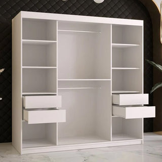 The CHOICEWARDROBE Rieti I Wooden Wardrobe features 2 white sliding doors, adjustable shelves, and gold handles. At 180cm, it offers modern bedroom storage and stands stylishly against a dark, quilted wall in a contemporary space.