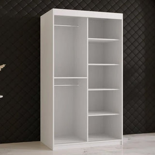 The CHOICEWARDROBE Rieti II Mirrored Wardrobe (100cm, white) has 2 sliding doors, shelves, a hanging rail, gold handles, and a full-length mirror. It’s shown against a black diamond-patterned wall on a white floor.