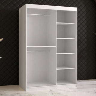 The CHOICEWARDROBE Rieti Mirrored 2 Door Sliding Wardrobe in white, featuring gold handles, a full-length mirror, and spacious storage with two hanging rods and four shelves, stands on a marble floor against a quilted black wall.