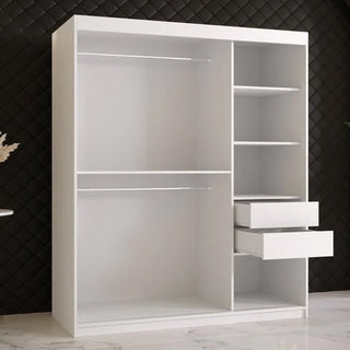 The CHOICEWARDROBE Rieti White Wooden Sliding Wardrobe (150cm, 2 doors) with modern panel detailing, shelves, and hanging rails offers sleek bedroom storage against a black quilted wall on a white marble floor.