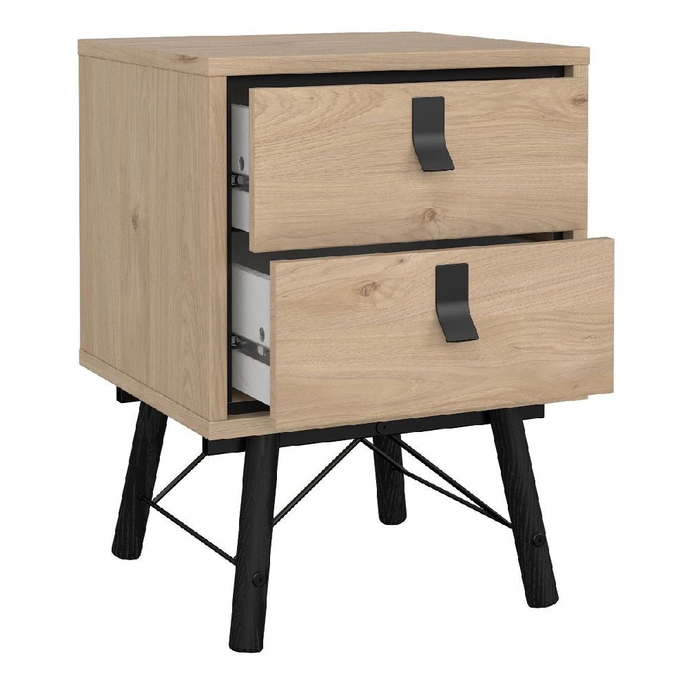 Oak and black industrial bedside table with two drawers and metal legs.