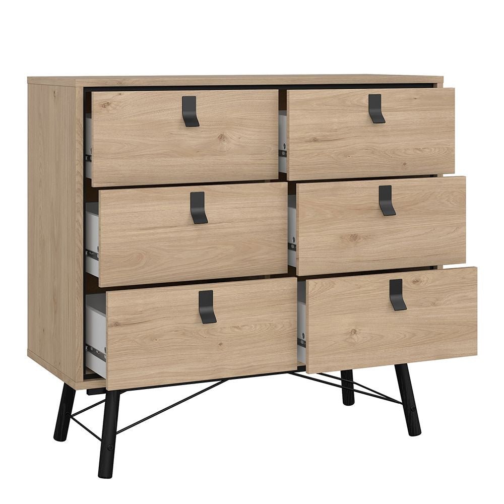 Oak chest of drawers with black metal legs, part of industrial loft bedroom set.