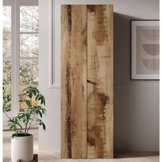 The CHOICEWARDROBE Salta 63cm Tall Wooden Wardrobe with 2 doors in Rustic Pearl Oak stands by a light wall near a window, complemented by a potted plant and abstract art. Its slim, modern design is ideal for small bedrooms.