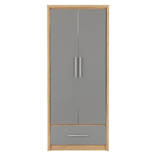The CHOICEWARDROBE Samaira 2 Door 1 Drawer Wardrobe features a 76 cm oak-effect frame, grey gloss doors with silver handles, and a bottom drawer—perfect compact bedroom storage.