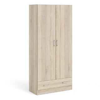 The CHOICEWARDROBE Scalia Oak Set features a 2 door wardrobe with silver handles and a bottom drawer in a natural light oak finish, part of a modern 3 piece bedroom collection including a chest and bedside table.