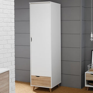 The CHOICEWARDROBE Selkirk 50cm Wooden Single Door Wardrobe in white and oak finish, featuring a bottom drawer, stands on short angled legs beside a gray paneled wall, offering modern compact storage for bedrooms or hallways.