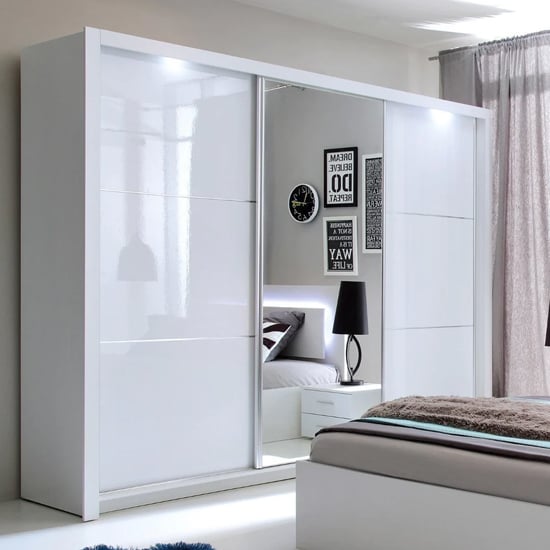 White high gloss sliding door wardrobe with mirrored doors and LED lighting, 258cm wide