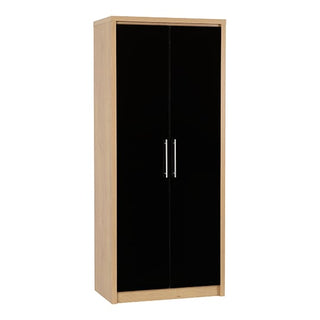 The CHOICEWARDROBE Seville 2 Door Wardrobe in black gloss and oak finish features tall glossy doors with silver vertical handles, offering modern bedroom storage with a hanging rail and shelving space.