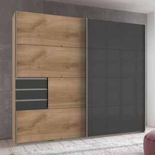 The CHOICEWARDROBE Sogo 2 Door Sliding Wardrobe (225 cm) features an oak and black two tone finish with sleek drawers, shelves, and hanging rails—perfect for modern interiors.
