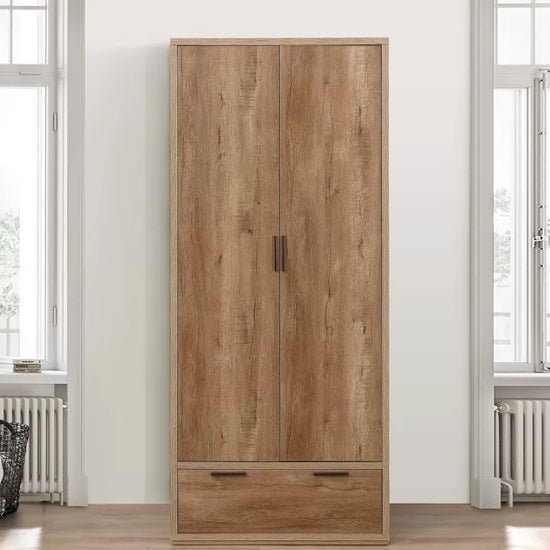 CHOICEWARDROBE rustic oak 2 door 1 drawer wooden wardrobe, situated between windows.