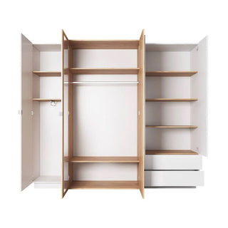 The CHOICEWARDROBE Sturgis 230cm 4 Door Wooden Wardrobe in white & oak features sliding doors, multiple shelves, hanging rail, and drawers on the right for optimal bedroom storage; doors and drawers are open to show its organized interior.