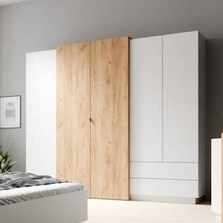 A modern bedroom showcases the CHOICEWARDROBE Sturgis 230cm 4 Door Wooden Wardrobe in White & Oak, a stylish sliding wardrobe with shelves, drawers, and hanging rail for practical and elegant storage.