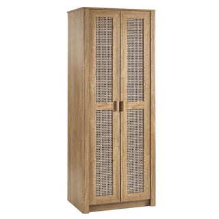 The CHOICEWARDROBE Sumter Oak & Rattan 2 Door Wardrobe features a natural wooden frame, woven cane panels, and a boho modern design—making it an ideal piece for adding stylish, natural oak decor to your bedroom.