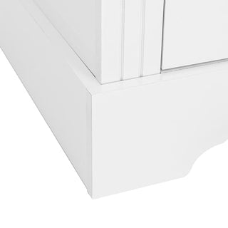 Close-up of the CHOICEWARDROBE Talox 142cm White Painted Wooden 3 Door Wardrobe with Oak Top, highlighting its decorative trim and molding details on the bottom corner.
