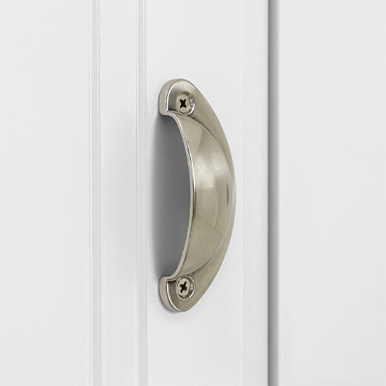 Close-up of brushed metal cup handle with two visible screws on a white wardrobe door.