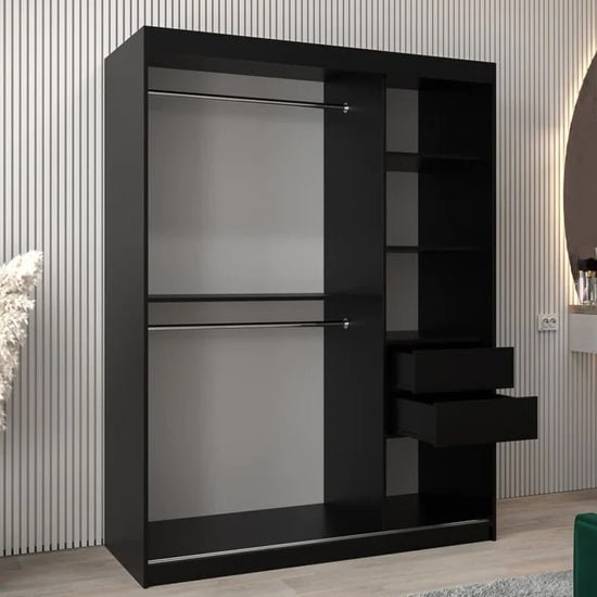 Black sliding wardrobe with mirrored doors, internal shelves and hanging rails