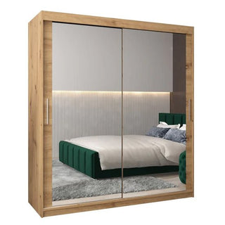 The CHOICEWARDROBE Tavira 180cm Artisan Oak Mirrored Sliding Door Wardrobe showcases a modern 2-door design with full-length mirrors and a natural wood finish, perfect for contemporary bedrooms with stylish décor.
