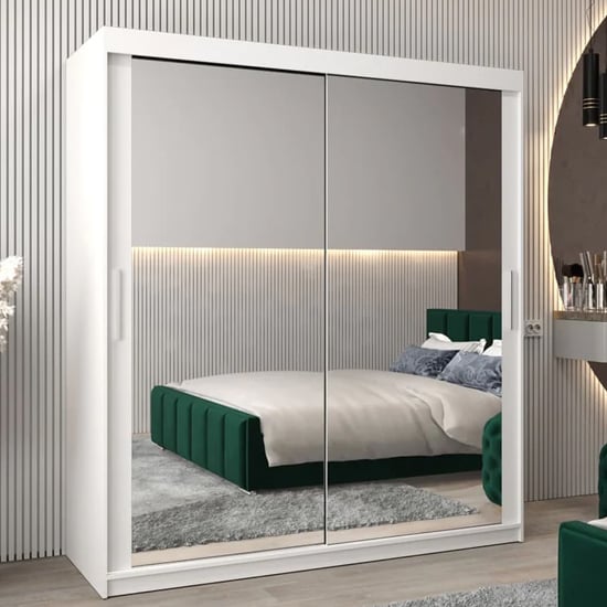 White CHOICEWARDROBE Tavira 180cm sliding door wardrobe with mirrored doors reflecting a bedroom.