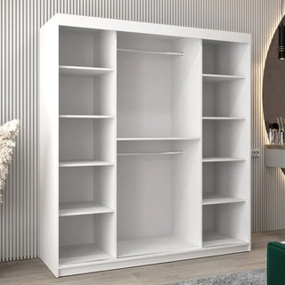 The CHOICEWARDROBE Tavira 2 Door Mirrored Sliding Wardrobe in a 180cm white finish features a modern space-saving design, with full mirror doors and internal shelving storage, placed against a wall with vertical grooves.