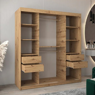 The CHOICEWARDROBE Tavira 2 Door Oak Effect Sliding Wardrobe with shelves, a mirrored finish, and a hanging rail is set against vertical white paneling. Nearby are a green chair and a vanity.
