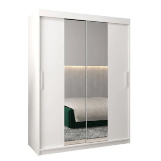 The CHOICEWARDROBE Tavira 2 Door Sliding Mirrored Wardrobe (150 cm, white) features modern design, shelves, and hanging space. Its mirrored doors reflect a bed with a green blanket, gray headboard, and an LED-lit wall behind.