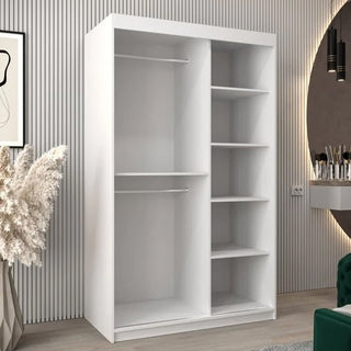 The CHOICEWARDROBE Tavira 2 Door Sliding Mirrored Wardrobe in white, featuring a compact 120cm design, smooth sliding doors, an elegant mirror, and functional shelving, provides bedroom storage in a modern room with stylish decor.