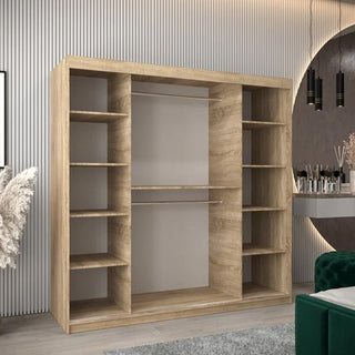 The CHOICEWARDROBE Tavira 2 Door Sliding Wardrobe (200 cm, Sonoma Oak finish) with shelves and hanging rails stands against a paneled wall, complemented by a vanity and green ottoman in the modern room.