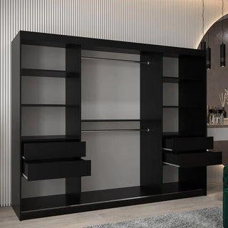 The CHOICEWARDROBE Tavira 3 Door Sliding Mirrored Wardrobe in black features an extra-wide 250cm design, central mirror, deep storage, and adjustable shelving—perfect for stylish bedroom organization against white paneled walls.