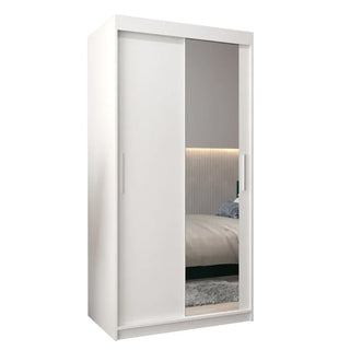 The CHOICEWARDROBE Tavira II 100cm wardrobe offers modern bedroom storage with two sliding doors—one full-length mirrored and one solid—in a sleek white finish, plus shelves and drawers for organized style.