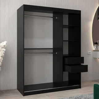 The CHOICEWARDROBE Tavira III Mirrored Wardrobe, 150cm wide in black, with 2 sliding doors, full-length mirrors, storage shelves, and hanging rails stands against a wall with vertical white paneling in a modern room.