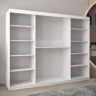 The CHOICEWARDROBE Tavira White High Gloss Mirrored Sliding Wardrobe (250cm, 3 doors) features luxury full mirror finish, shelves, drawers, and hanging rails—offering ample bedroom storage in a modern setting.