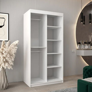 The CHOICEWARDROBE Tavira Wooden Wardrobe features 2 sliding doors, internal storage shelves, and a sleek white minimalist design—perfect for modern bedrooms with vertical wall panels, plants, wall art, and a round mirror above the vanity.