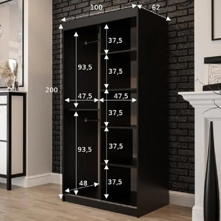 The CHOICEWARDROBE Topeka 100cm Dark Oak & Black Sliding Mirrored Wardrobe stands against a black brick wall, measuring 200cm H x 100cm W x 62cm D, with internal shelves and compartments labeled by length for modern bedrooms.
