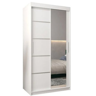 The CHOICEWARDROBE Vevey 100cm White Mirrored Sliding Wardrobe features two modern doors—one with horizontal grooves, the other a full-length mirror—and offers shelves plus a hanging rail for stylish, practical bedroom storage.