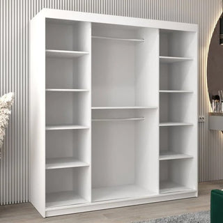 The CHOICEWARDROBE Vevey III 180cm Mirrored Sliding Door Wardrobe in a white finish features shelves, drawers, and hanging rails for efficient storage. Its modern double-door design stands against a wall; a round mirror and vanity are partially visible nearby.