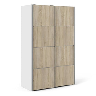 The CHOICEWARDROBE Vrok Oak & White Sliding Wardrobe features a modern dual-tone finish with two sliding doors, shelves, and a hanging rail in a sleek 122 cm design.