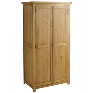 The CHOICEWARDROBE Webworms 2 Door Solid Oak Wardrobe is a tall, rectangular wardrobe in a light natural oak finish with two paneled doors and metal knobs. It stands on short legs, features a flat top, and offers compact full hanging storage.