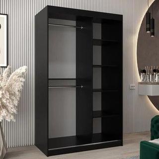The Eden Mirrored Wardrobe 2 Sliding Doors 120cm in Black, featuring two hanging rods and five shelves, adds a stylish touch to any modern bedroom with light walls and contemporary furnishings.