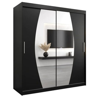 The Eden Mirrored Wardrobe 2 Sliding Doors 180cm In Black has sleek mirrored doors and vertical handles, reflecting stylish decor in a modern room—making it an ideal contemporary bedroom furniture piece.