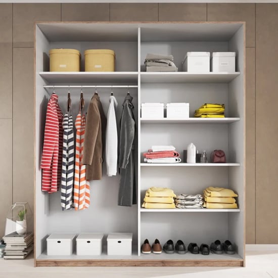 CHOICEWARDROBE Glens 200cm sliding door wardrobe in Monastery Oak, showing hanging clothes and shelved storage.