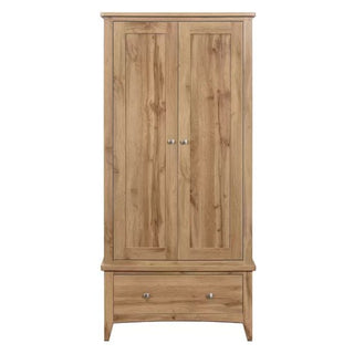 The Hebron Wooden Wardrobe With 2 Doors 1 Drawer In Oak offers bedroom storage with a natural wood finish, metal knobs, a wide bottom drawer, and a simple rectangular design.