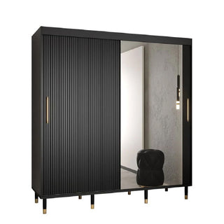 The Millwall 200cm Mirrored Wardrobe in black features two sliding doors—one with vertical grooves, the other a large mirror—six legs with gold accents, and offers stylish, compact bedroom storage while reflecting your décor.